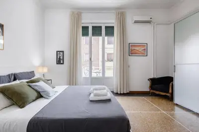a bedroom with a large bed and a window at Eleganza&Confort in Roma-Liberty- in Rome