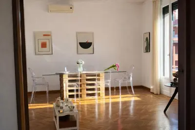 a dining room with a table and chairs in a room at Eleganza&Confort in Roma-Liberty- in Rome