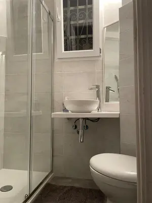 a bathroom with a toilet and a sink and a shower at Eleganza&Confort in Roma-Liberty- in Rome