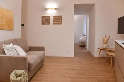 a living room with a couch and a table at Maralf Urban Suites in Rome