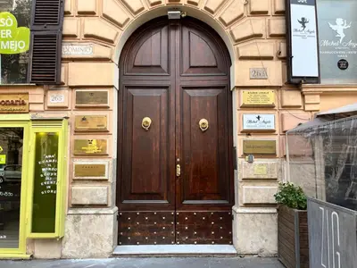 a wooden door on the side of a building at Maralf Urban Suites in Rome