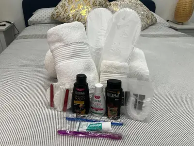a bed with towels and toothbrushes and other bathroom items at Casa Romi in Rome