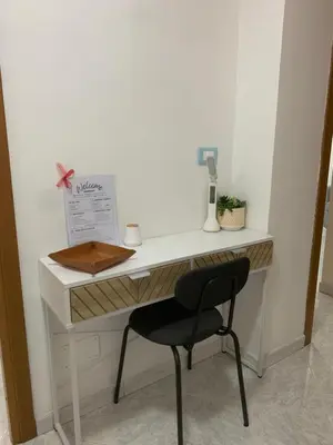 a desk with a black chair in a room at Casa Romi in Rome