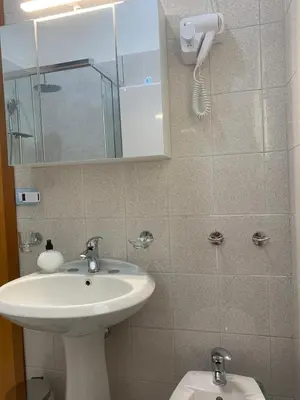 a bathroom with a sink and a toilet at Casa Romi in Rome