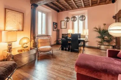 a living room filled with furniture and a piano at Charme Apt in Piazza Monti in Rome