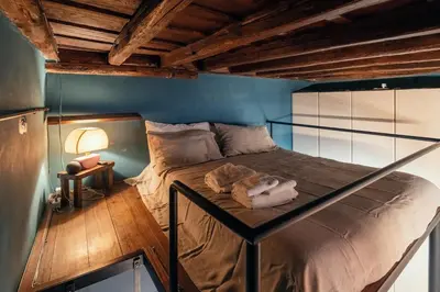 a bedroom with a bed with a glass canopy at Charme Apt in Piazza Monti in Rome