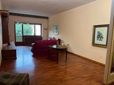 a living room with a bed and a table at Apartment in Trastevere 41 in Rome