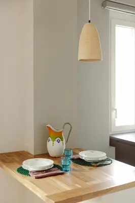 a kitchen counter with two plates and a vase on it at Pinturicchio's Rooms at Flaminio in Rome
