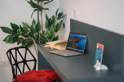 a laptop computer sitting on top of a desk at Luxury Sweet Home Labicana in Rome
