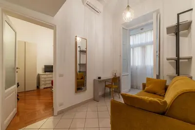 a living room with a couch and a table at GuestHost - Zia Pina's Apartment in Rome