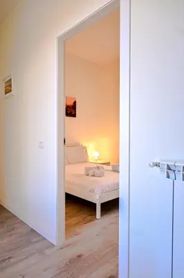 a bedroom with a bed in a room with a mirror at Collection39 Scipioni Luxury Penthouse in Rome