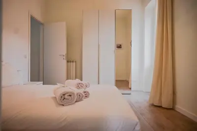 a bedroom with a bed with towels on it at Collection39 Scipioni Luxury Penthouse in Rome