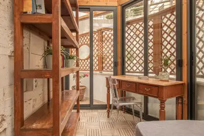 a home office with a desk and a ladder at A casa di Carlo Roma Vaticano in Rome