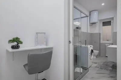 a bathroom with a sink and a toilet in it at Carlo's House Suite with Private Terrace in Rome