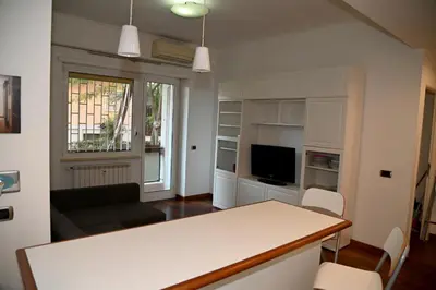 a living room with a table and a couch at Casa 12 in Rome