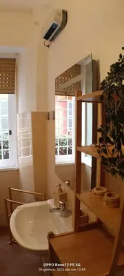 a bathroom with a sink and a mirror at Appartamento Cornelia near San Pietro in Rome