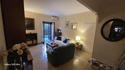 a living room with a couch and a table at Casa Orietta in Rome