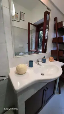 a bathroom with a sink and a mirror at Casa Orietta in Rome