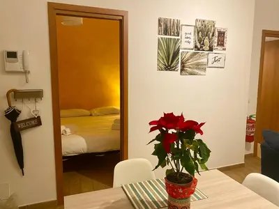 a room with a table with a potted plant on it at Appartamento Rea Silvia in Rome