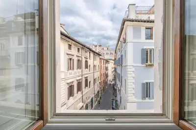 a view from a window of a city street at Casa Giulia, a Burghesius home in Rome