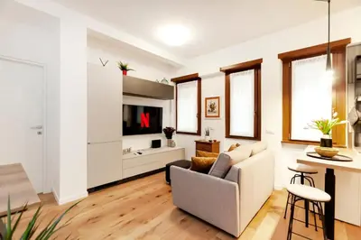 a living room with a couch and a tv at Dimora Cavallini in Rome