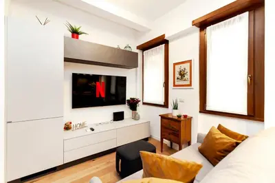 a living room with a tv and a couch at Dimora Cavallini in Rome