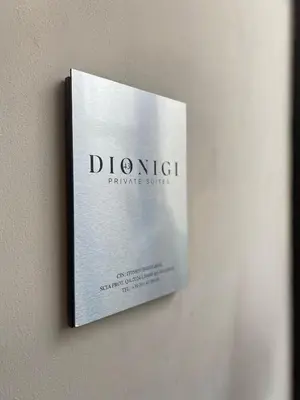 a book hanging on a wall at Dionigi 43 Private Suites by Premium Suites Collection in Rome