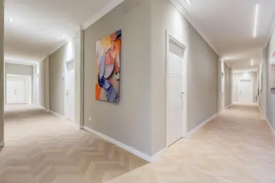 a hallway with white walls and a painting on the wall at Dionigi 43 Private Suites by Premium Suites Collection in Rome