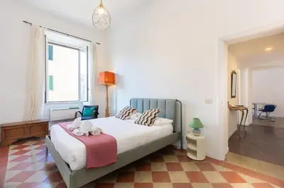a bedroom with a bed and a window at Casa Assunta in Rome