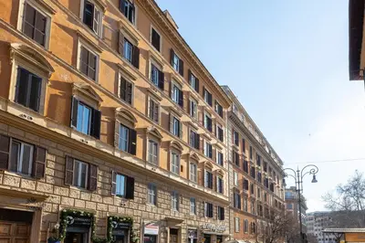 a large brick building on a city street at Casa Assunta in Rome
