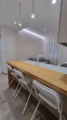 a table and chairs in a room at T&T Luxury Home Rome Int 5 in Rome