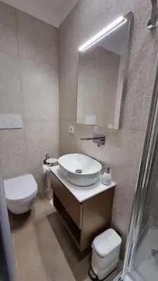 a bathroom with a sink and a toilet and a mirror at T&T Luxury Home Rome Int 5 in Rome