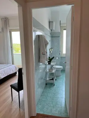 a bathroom with a tub and a toilet and a sink at Tiburtina Sky Loft in Rome