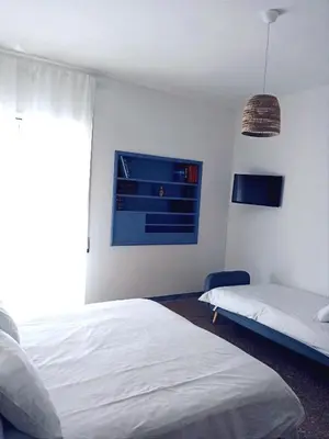 a bedroom with a white bed and a window at DOMUS REMO Room #1 in Rome