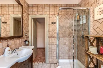 a bathroom with a sink and a shower at Casa Vacanze San Giovanni in Rome