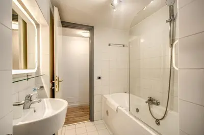 a bathroom with a tub and a sink and a shower at Casa Vacanze Crispi in Rome