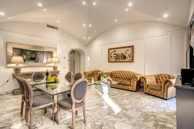 a living room with a table and chairs at Casa Vacanze Crispi in Rome