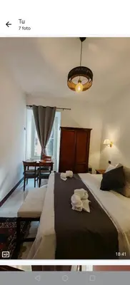 a bedroom with a large bed with towels on it at Front Vatican museum in Rome