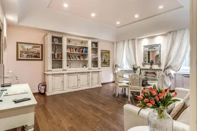 a large living room with a large wooden cabinet at Casa Vacanze Crispi little 1 in Rome