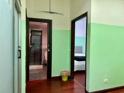 a room with two doors and a room with a bedroom at Bellaroma Astréa apartment in Rome