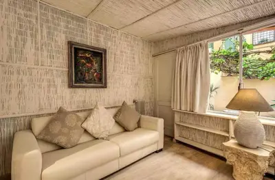 a living room with a couch and a window at Casa Vacanze Crispi little 2 in Rome