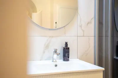 a bathroom with a sink and a mirror at Oliviero - Piazza Navona Suite in Rome
