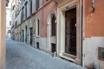 an empty street in a city with a building at Oliviero - Piazza Navona Suite in Rome