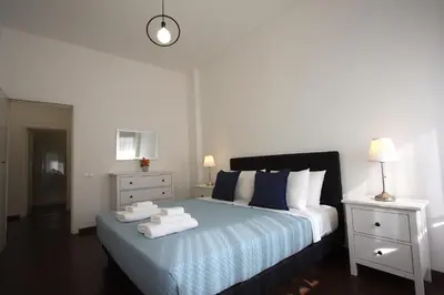 a bedroom with a bed with towels on it at Villa Borghese Holiday House in Rome