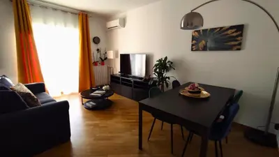 a living room with a table and a couch at Clivo Vaticano Rooftop in Rome