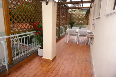 a balcony with a table and chairs on it at Clivo Vaticano Rooftop in Rome