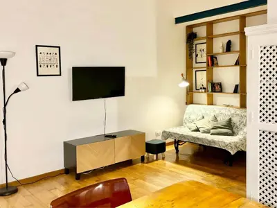 a living room with a television and a couch at RomeAsYouLike - Colonna Apartment N 50 in Rome