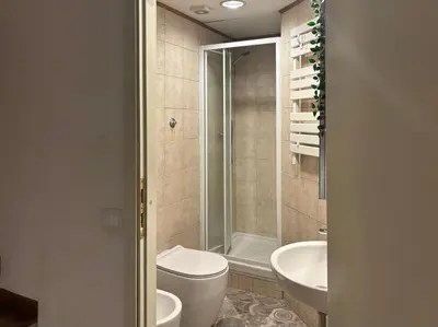 a bathroom with a toilet and a sink and a shower at RomeAsYouLike - Colonna Apartment N 50 in Rome