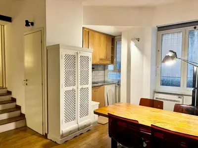 a kitchen with a table and a dining room at RomeAsYouLike - Colonna Apartment N 50 in Rome