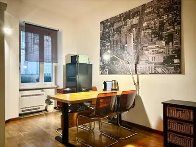 a kitchen with a table and chairs and a refrigerator at RomeAsYouLike - Colonna Apartment N 50 in Rome